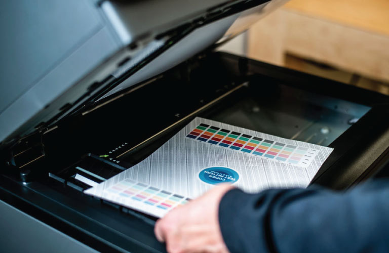 Person Copying a Colour Document on a Photocopier